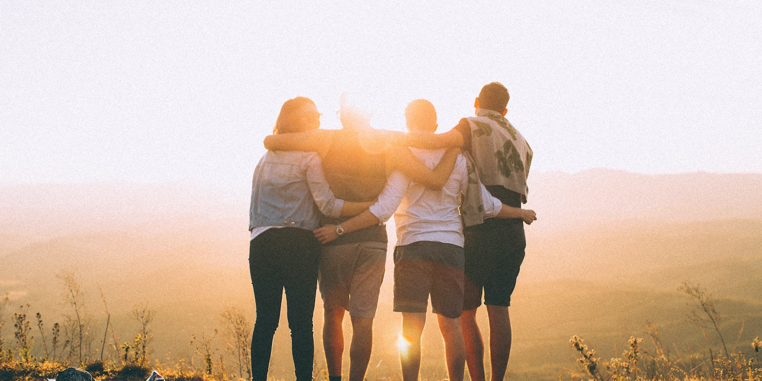 Group of people embracing outdoors