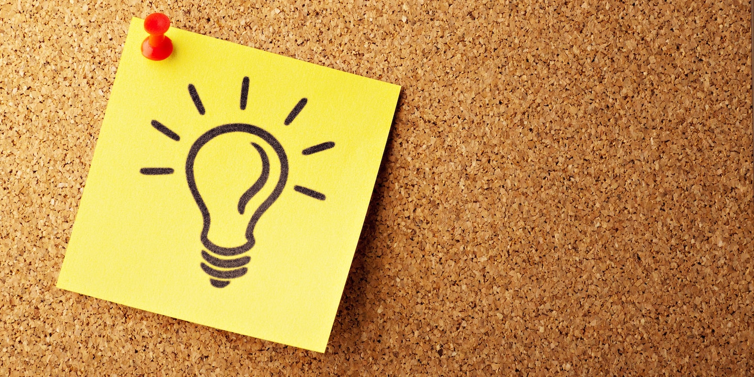 Lightbulb (idea) on pin board. 