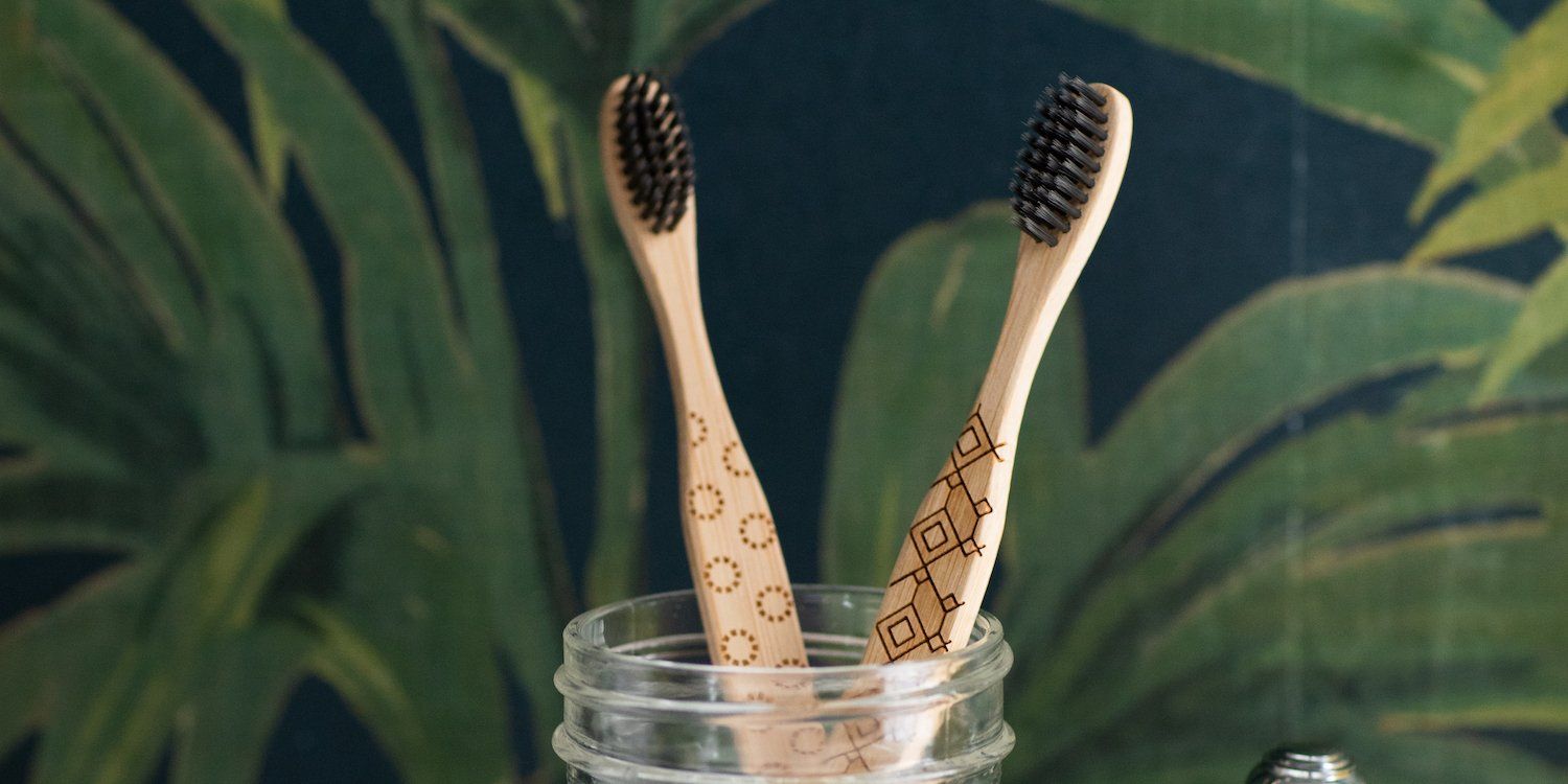 Bamboo Toothbrushes In Glass Jar